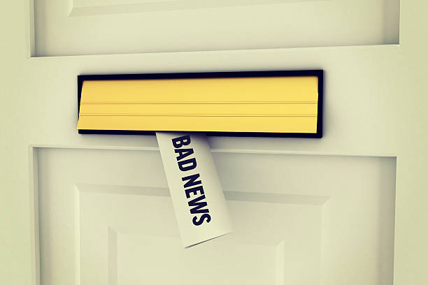 istock Bad news against letter through post box 470233096