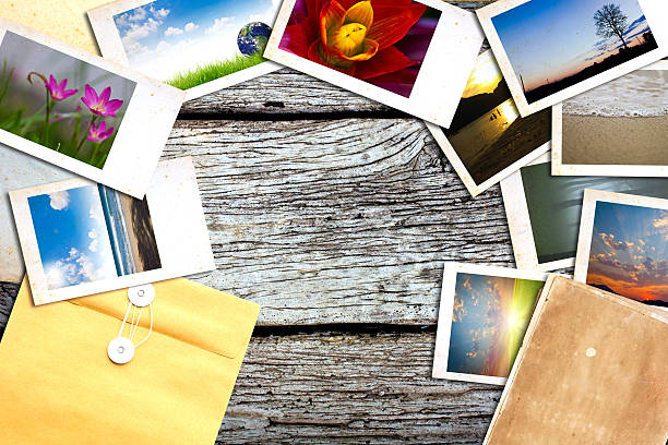 istock Old paper and photos on wooden table 470236413