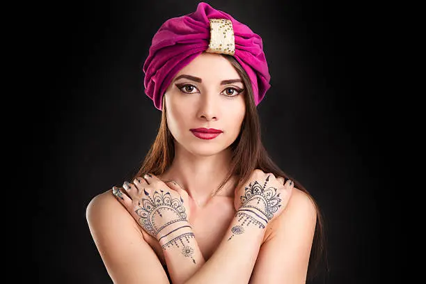 Photo of beautiful stylish woman in oriental style in turban