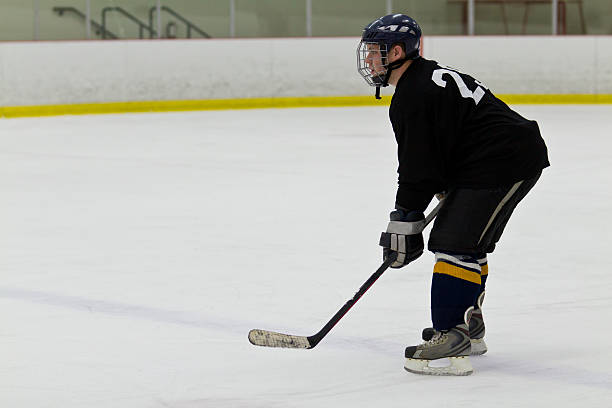 istock Hockey player patrolling the blue line 470238529