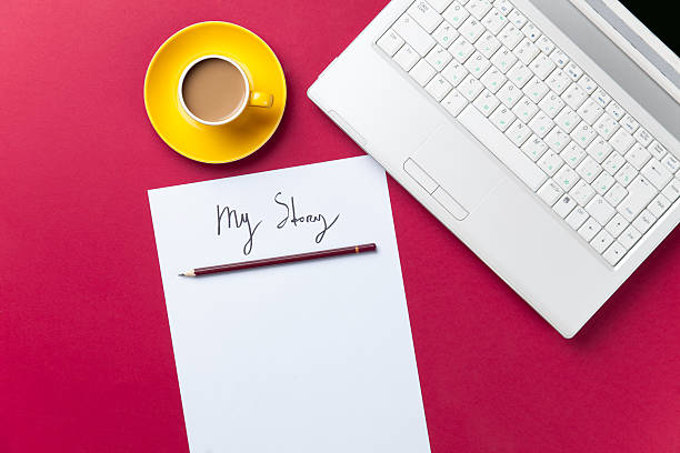 istock cup of coffee and computer with paper and pencil 470241528