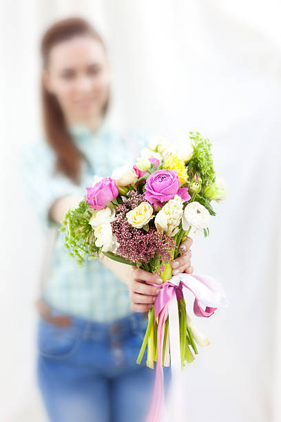 istock Bunch of random flowers closeup in florist's hands 470242724