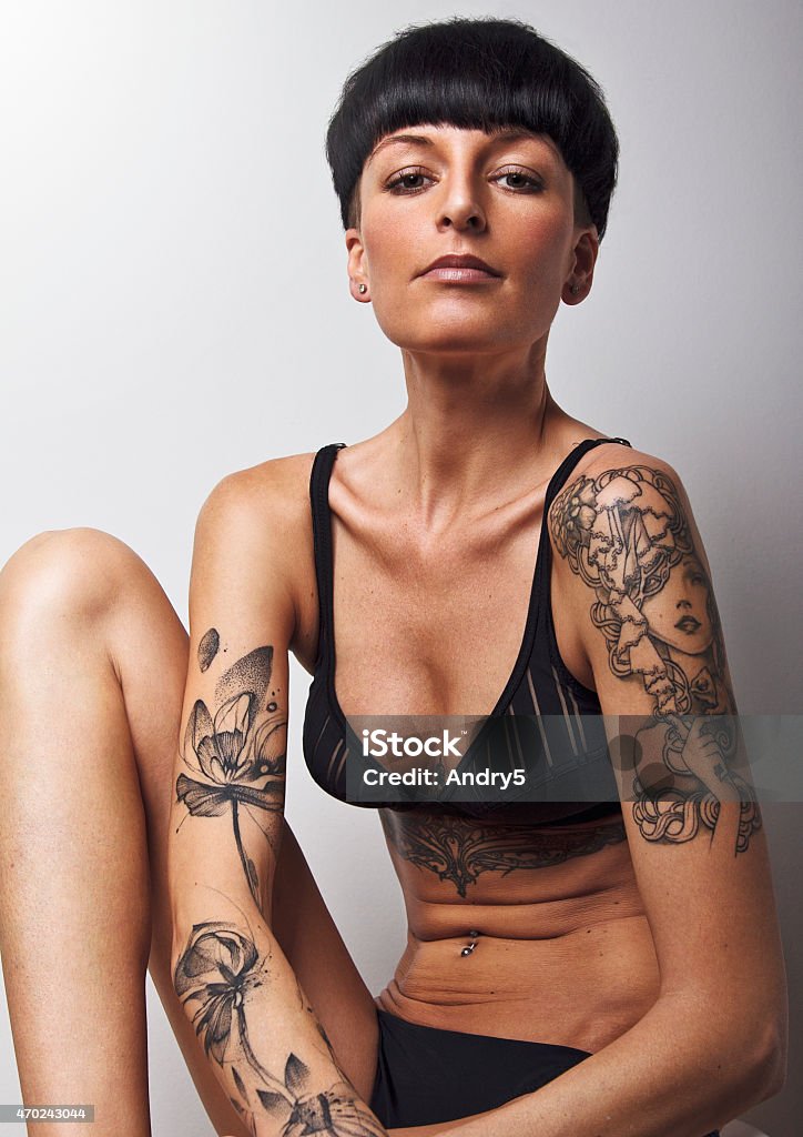 Woman With Short Black Hair And Tattoos Stock Photo - Download Image Now -  Tattoo, Women, One Woman Only - iStock