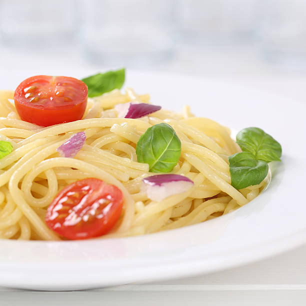 istock Italian cuisine spaghetti with tomatoes noodles pasta on a plate 470243336