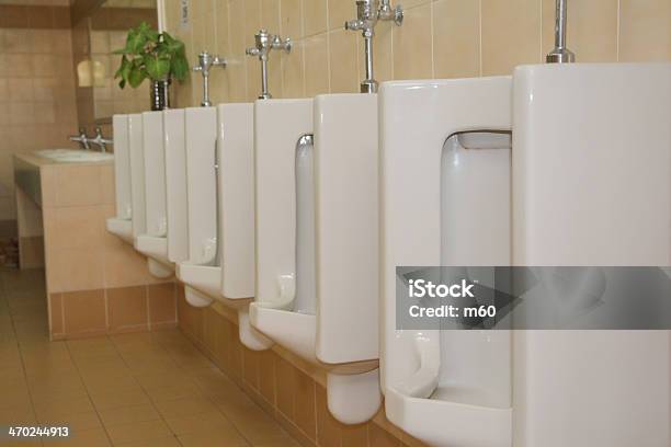 Line Of White Urinals In Public Toilets Stock Photo - Download Image Now - Bathroom, Ceramics, Chrome