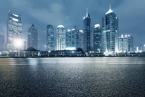 istock urban road,illuminated skyline background 470247350
