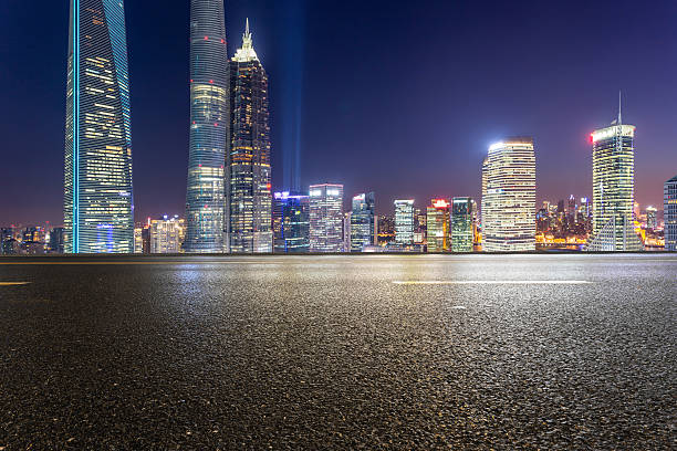 istock urban road,illuminated skyline background 470248428