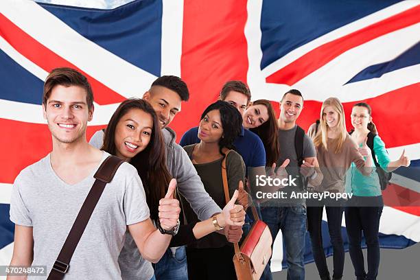 A English Flag And A Diverse Group Of People Stock Photo - Download Image Now - English Culture, Learning, University Student