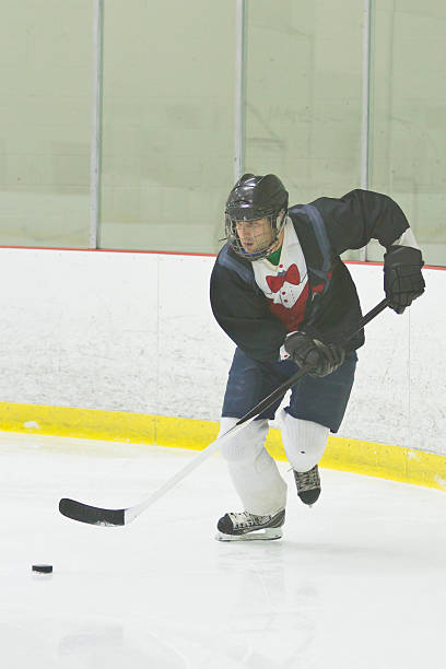istock Hockey player skating with the puck 470250811