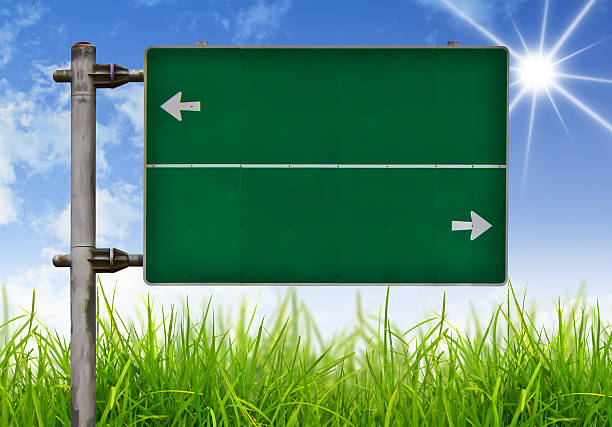 istock Traffic sign on green grass and blue sky. 470252077