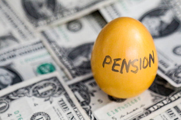 istock Golden egg labeled PENSION on dollar bills 470252550