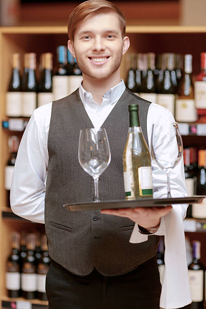 istock Sommelier with a tray and glasses 470255288