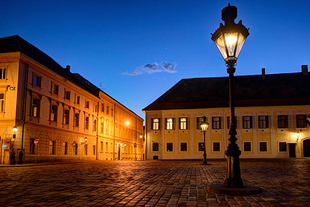 Historic lanterns on Zagrebs' Upper Town square at dusk with bright Venus shining in the evening sky.