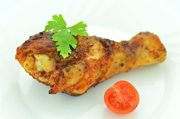 delicious fried chicken leg on white plate