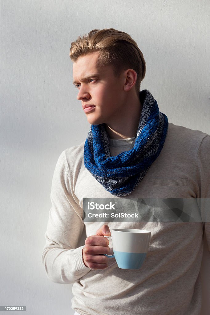 Coffee Break Young man dressed in warm clothing having a cup of coffee. 20-29 Years Stock Photo