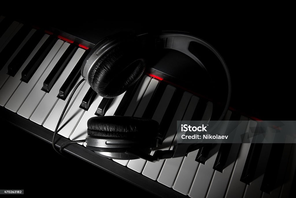 Piano keyboard with headphones Piano (digital piano) keyboard with headphones 2015 Stock Photo