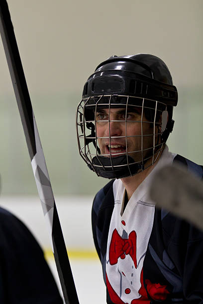 istock Hockey player watches the game 470269929