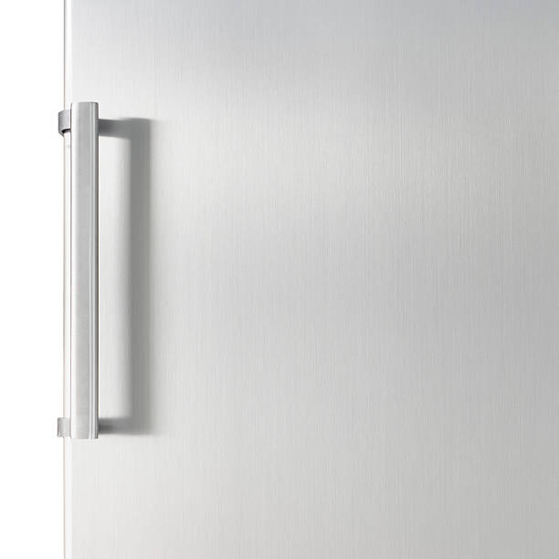 White fridge door with a silver handle Silver fridge door with handle, with free space for text refrigerator photos stock pictures, royalty-free photos & images