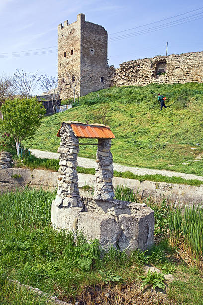 Genoese fortress is in Feodosiya Remains of ancient fortress wall and tower on a hill feodosiya stock pictures, royalty-free photos & images
