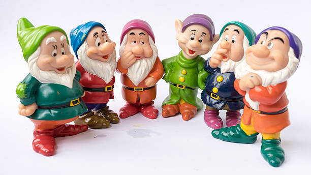 Figure toy of dwarf from Disney's fantasy film Snow White Kuala Lumpur, Malaysia - March 19, 2015 : Figure toy of dwarf from Disney's 1937 American animated musical fantasy film Snow White and the Seven Dwarfs. Film was produced by Walt Disney Productions animator photos stock pictures, royalty-free photos & images