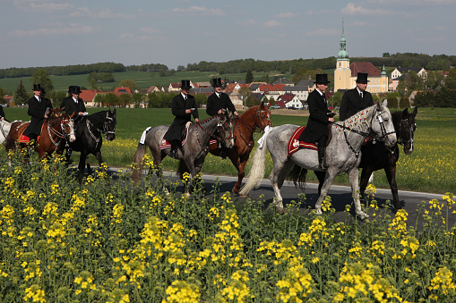 Crostwitz, Germany - April 24, 2011: Easter Riders attend the Easter ceremonial equestrian procession in the Lusatian village of Crostwitz near Bautzen, Upper Lusatia, Saxony, Germany.
