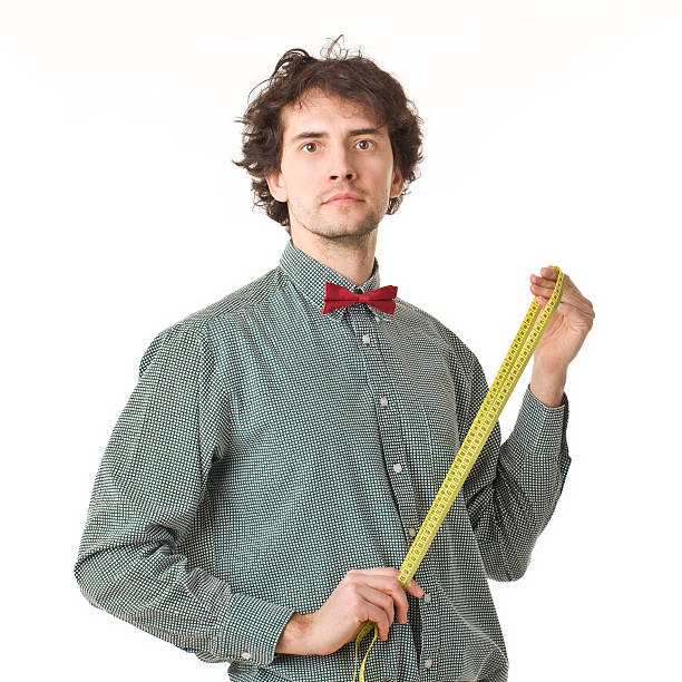 istock Handsome Man Wearing Measuring Tape. 470282562