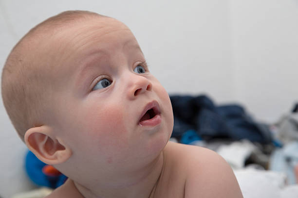 Portrait of a cheerful newborn.