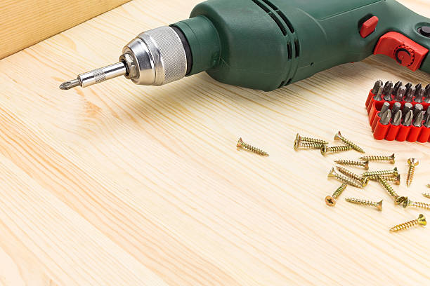 istock Electric screwdriver and screws 470286024