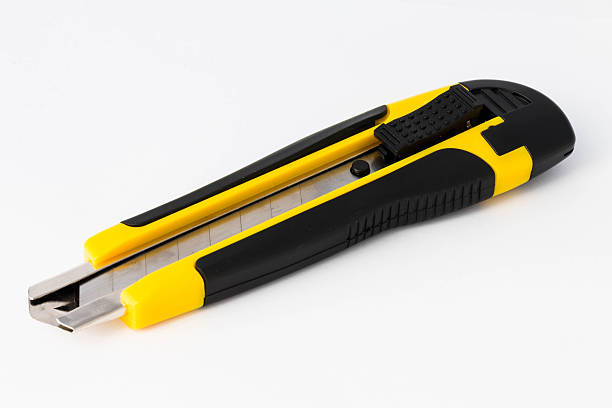 istock Yellow paper knife isolated on white background 470289278