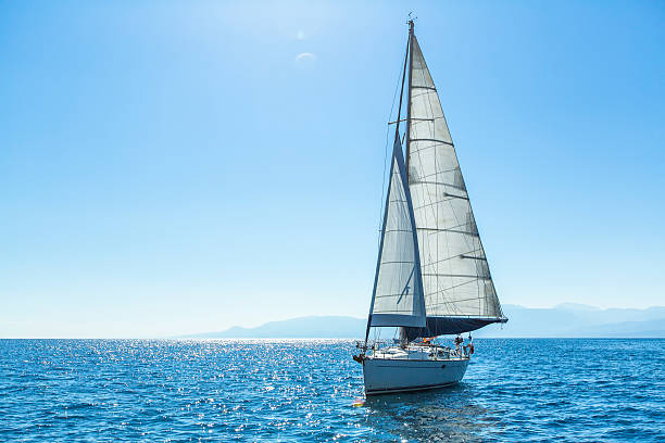 istock Sailing ship yachts with white sails in the open Sea. 470289320