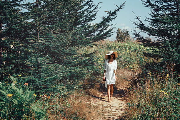istock Beautiful woman walking on summer nature 470289322