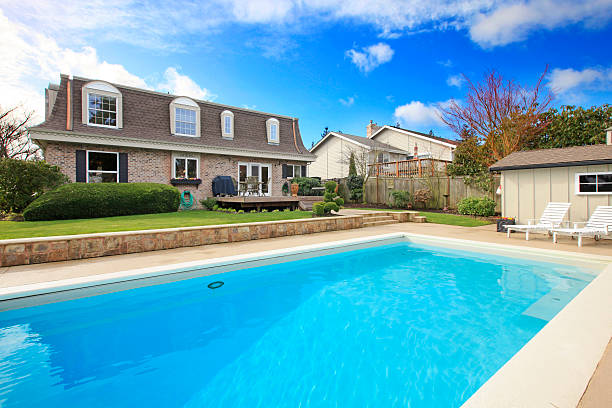 istock Large backyard with flowerbed and swimming pool 470291877