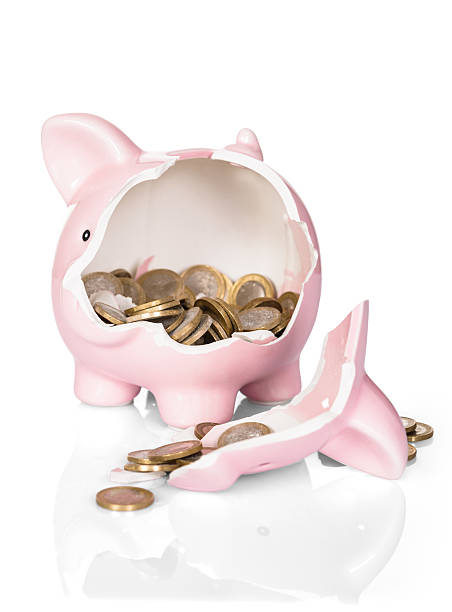 istock Broken Piggy Bank With Money 470293530