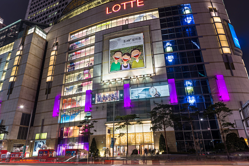 Seoul, South Korea - February 14, 2015: Lotte department store lit up at night in the Myeongdong district of Seoul, South Korea.