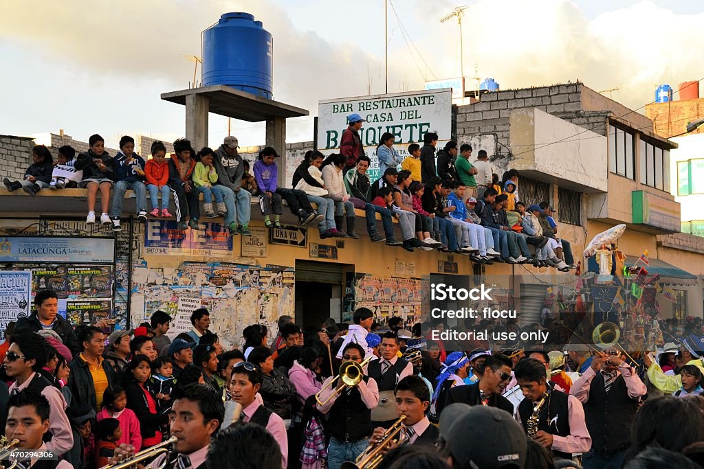 Onlookers are watching La Fiesta de la Mama Negra traditional Latacunga, Ecuador 30 September, 2012: Onlookers are watching the parade for La Fiesta de la Mama Negra traditional festival.  Mama Negra Festival is a mixture of indigenous, Spanish and African influences and celebrates the patron saint Virgen de la Merced supposedly stopping the 1742 eruption of nearby volcano Cotopaxi, leaving Latacunga unharmed. 2015 Stock Photo