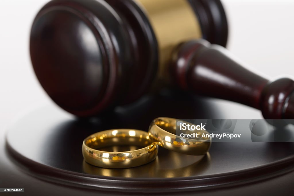 Wedding Rings And Wooden Gavel Close-up Of Wedding Rings And Wooden Gavel 2015 Stock Photo