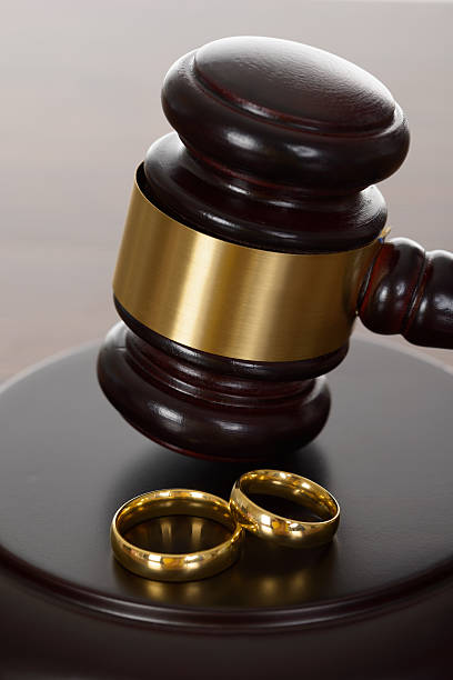 istock Wedding Rings And Wooden Gavel 470296834