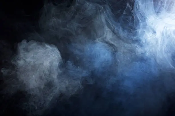 Photo of Swirling Grey and blue smoke