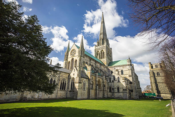 Chichester Cathedral in Springtime The Cathedral at Chichester from West Street on a sunny early spring day. chichester stock pictures, royalty-free photos & images