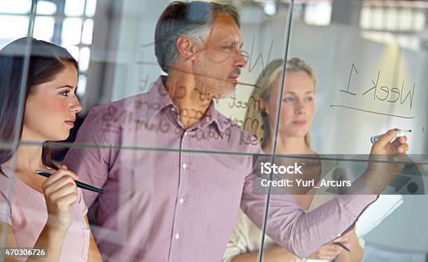 Setting Up A Schedule For Their Latest Project Stock Photo - Download Image Now - Corporate Business, Mature Adult, Meeting