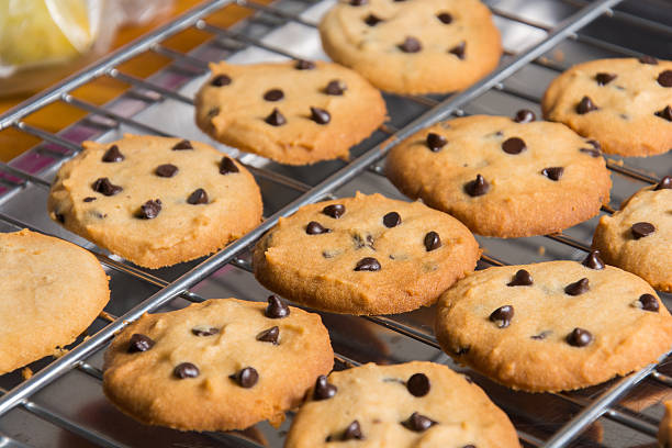 istock Freshly baked chocolate chip cookies on cooling rack. 470306948