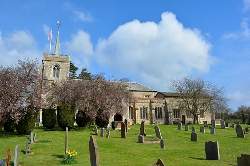The church of St Peter and St Paul in Kimpton.  This flint-built parish church is in a transitional style between Norman and Early English. The Dacre Chapel has a Perpendicular screen, and the remains of early wall paintings in the chancel show St Christopher and the Seven Corporal Works of Mercy.