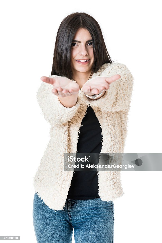 Attractive Girl Showing Empty Hands and Presenting your Product Young Attractive Fashionable Girl Showing to the copy space and presenting your product. Isolated on white. 20-29 Years Stock Photo