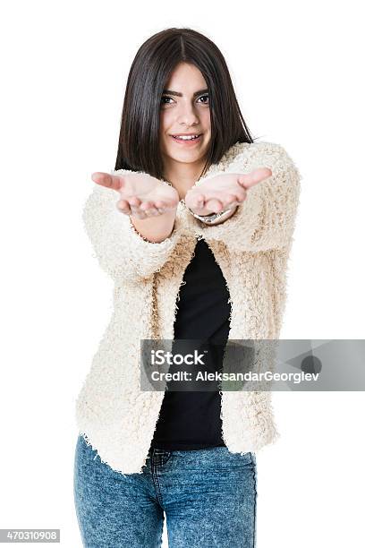 Attractive Girl Showing Empty Hands And Presenting Your Product Stock Photo - Download Image Now