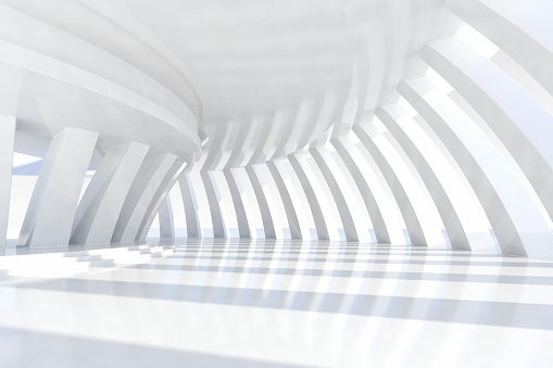Empty space with rows of white arches forming a tunnel, with sunlight illuminating the wide architectural space, casting shadows and a light pattern on the floor. White glossy material reflecting the three-dimensional elements gives the scene a modern and futuristic style. Wideangle view. Copy space.
