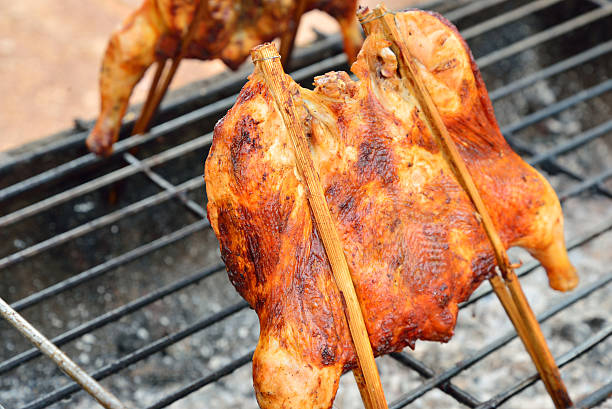 istock Grilled chicken thigh on the flaming grill 470314654