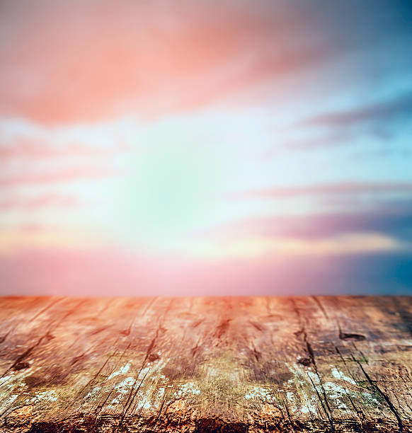 istock Rustic wooden table over sunset sky, nature background. 470315136