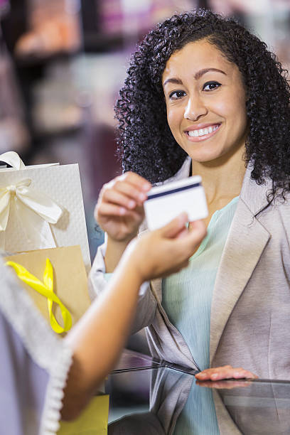 istock Store cashier taking credit card payment from customer 470315168