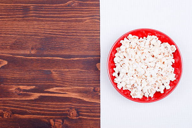 istock popcorn in a bowl on the table top view 470318828