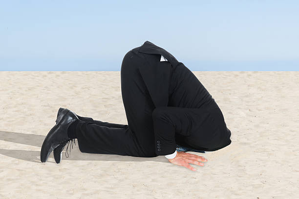 istock Businessman Hiding His Head In Sand 470318938